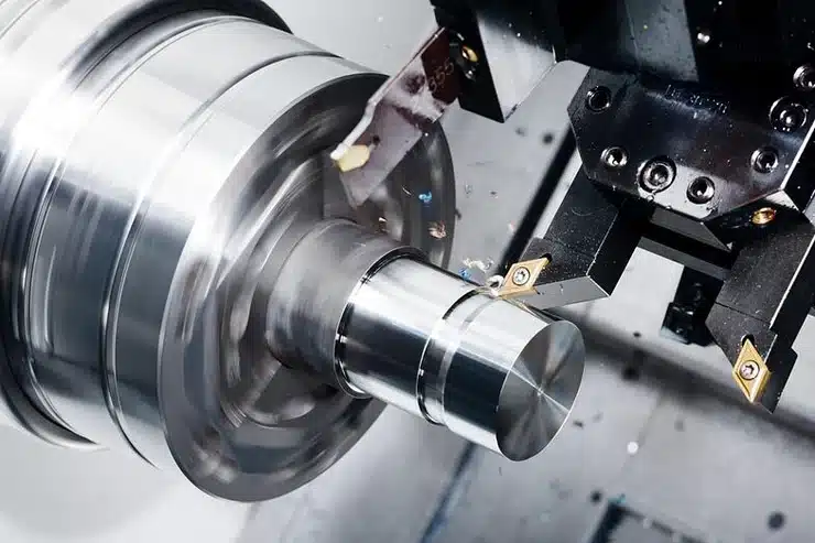 CNC lathe machining a workpiece, showing CNC Turned Parts in production